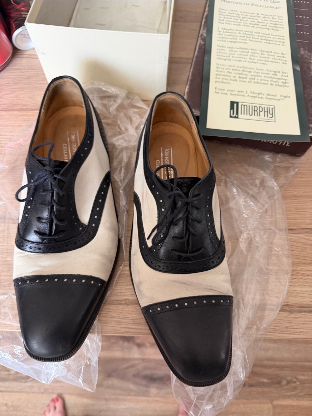 Johnston & Murphy Black and Cream Cap-Toe Saddle Oxfords